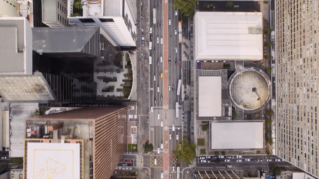 Aerial Top-Down View of a Bustling City Street with Traffic and Skyscrapers in São Paulo