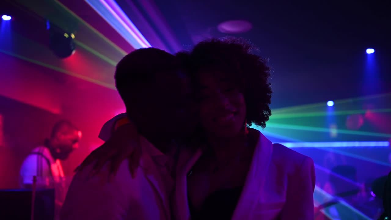 Ethnic couple dancing in nightclub
