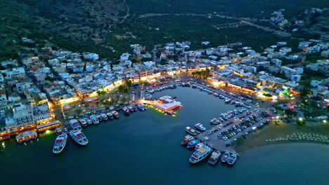 port elounda crete island, greece aerial at night, marina boats moored