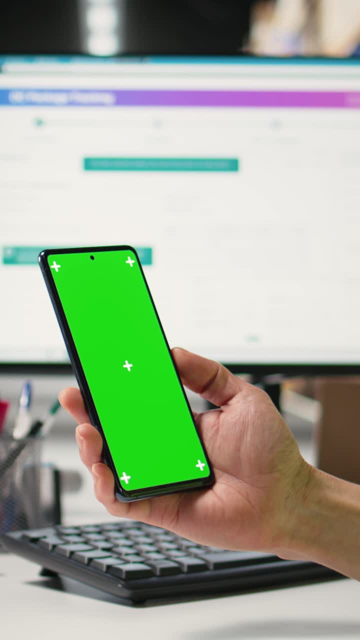 Vertical Video Warehouse staff in a hi-vis vest uses copy space display with technology