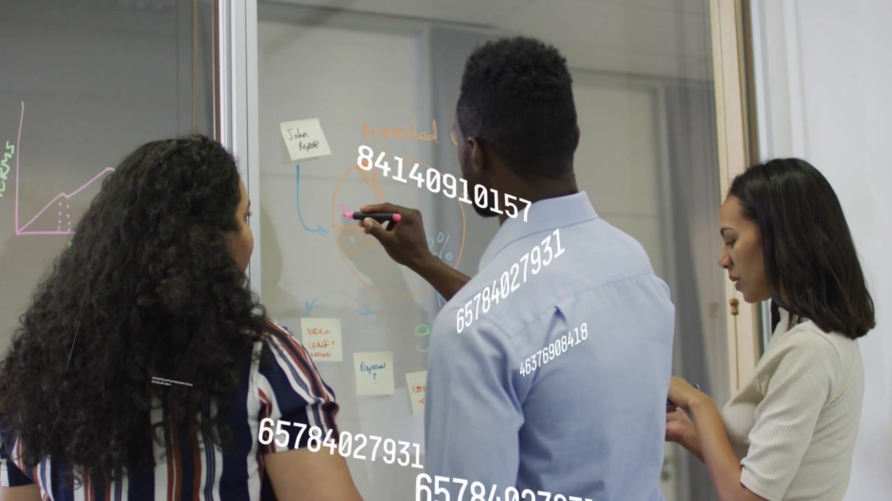 Man picking marker, drawing on glass, women moving sticky notes, data overlays aiding project plan
