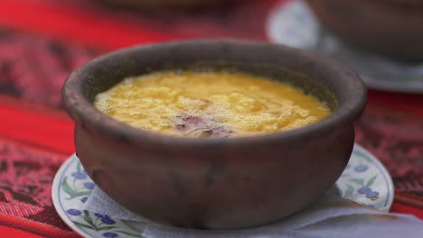 hot boiling argentine humita peasant dish served in a casserole, close up