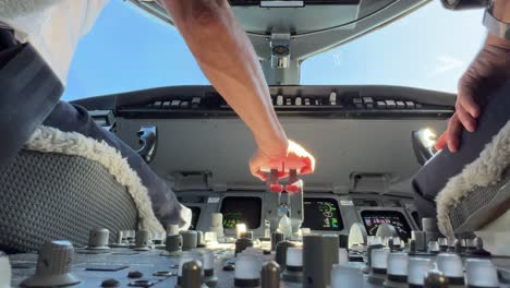 an unique close up view of a modern jet cockpit, low angle, during a real flight