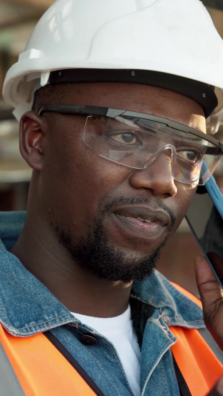 Construction Worker Talking on Smartphone at Job Site