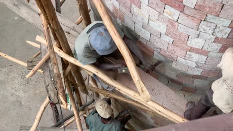 workers are renewing old stones in building