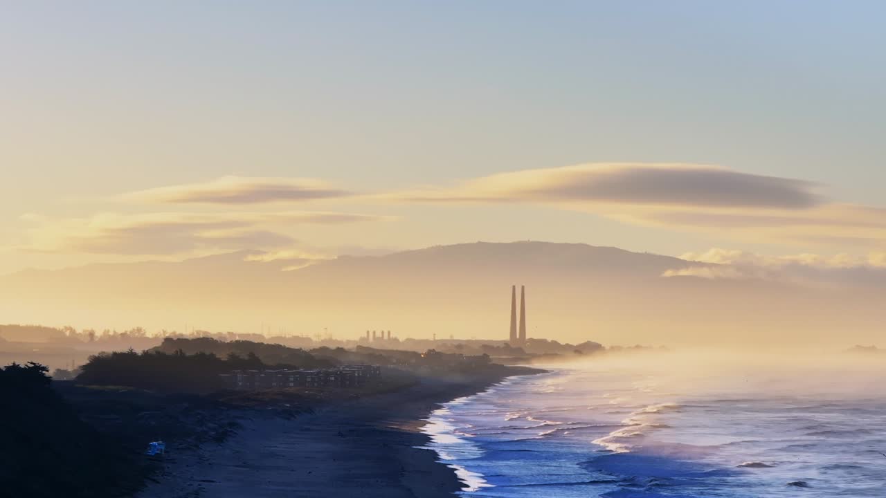 Moss Landing Powerplant Twin Towers warm sunrise morning mist seafog California aerial drone Sunset State Beach Pajaro Dunes Santa Cruz Manresa waves Monterey Bay Pacific Ocean static shot