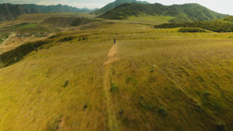 rider slices across challenging landscape. motorcycle tires churning up dust as example of vivid symbol of exhilaration inherent in extreme motocross