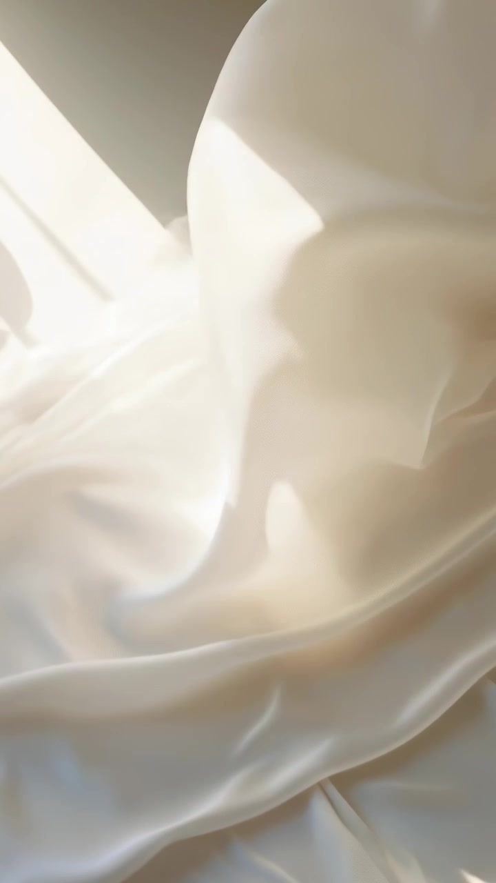 Soft Cream Fabric Draping with Gentle Sunlight and Shadows