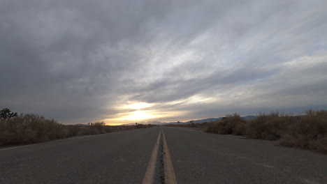 empty road time lapse in the mojave desert on a cloudy day