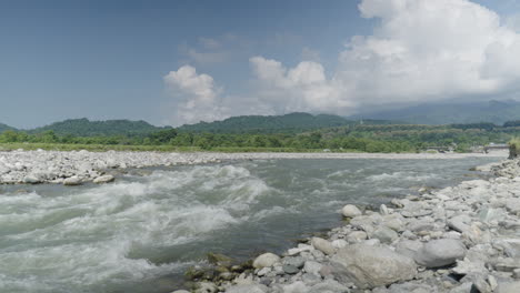 beautiful landscape on sunny day, river rapids in foreground