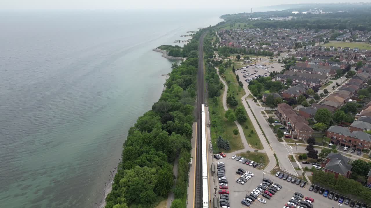 Aerial flyover of Rouge Beach with cloud reflections in calm water