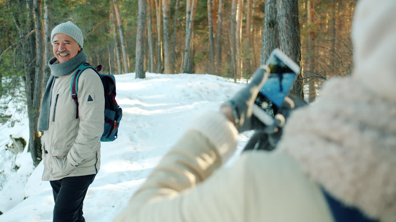 Senior Man Hiked in the Snowy Forest