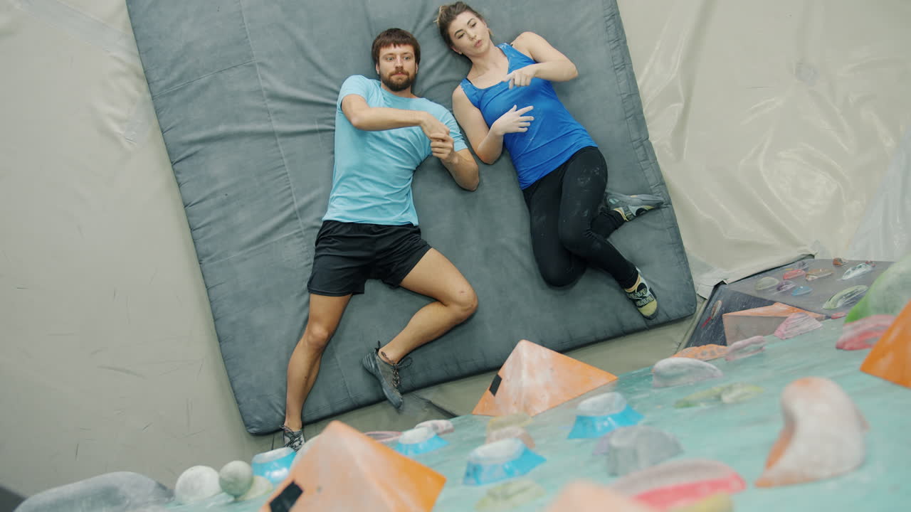 Couple Practicing Bouldering Exercise