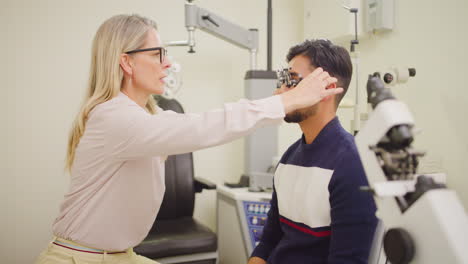 Ophthalmologist-giving-male-patient-an-eye-test