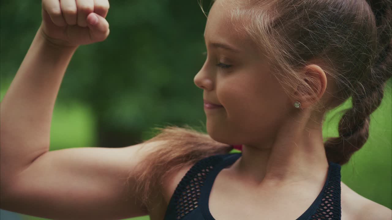 A Playful Moment: Capturing Joyful Expressions of a Young Girl in Nature with a Beautiful Smile and Gleaming Eyes Under Natural Light