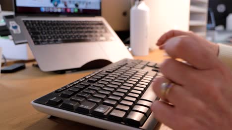 typing on keyboard in modern office setup