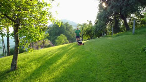 Man-mowing-his-lawn-with-small-petrol-lawnmower