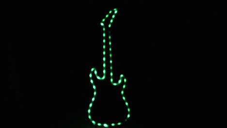 Forma-De-Guitarra-Eléctrica-Desenfocada-Con-Leds-Verdes