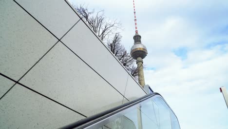 leaving underground station and famous tv tower of berlin appears