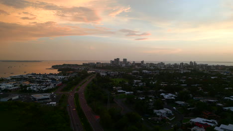 Aerial-drone-of-magical-sunset-sunrise-view-of-coastal-ocean-side-city