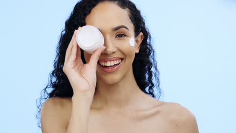 rostro, frasco de crema y belleza de la mujer