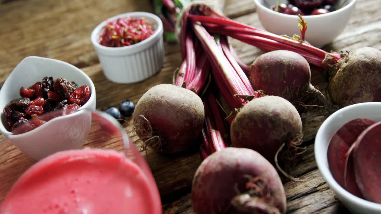 Radish with radish juice on wooden table 4k