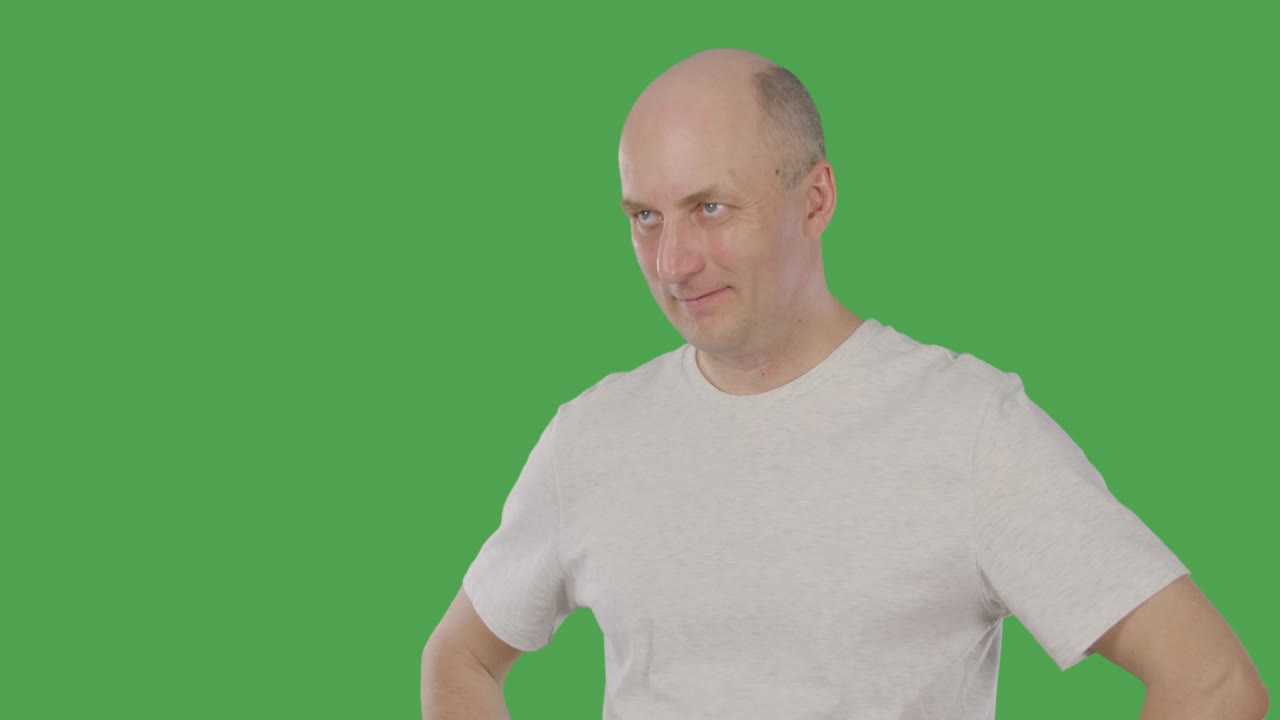 Adult man nodding head and listening interlocutor isolated on green background. Alpha channel, keyed green screen