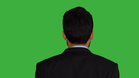 young asian man isolated on green screen background. portrait of businessman representing business strategy ideas. professional lifestyle shot.