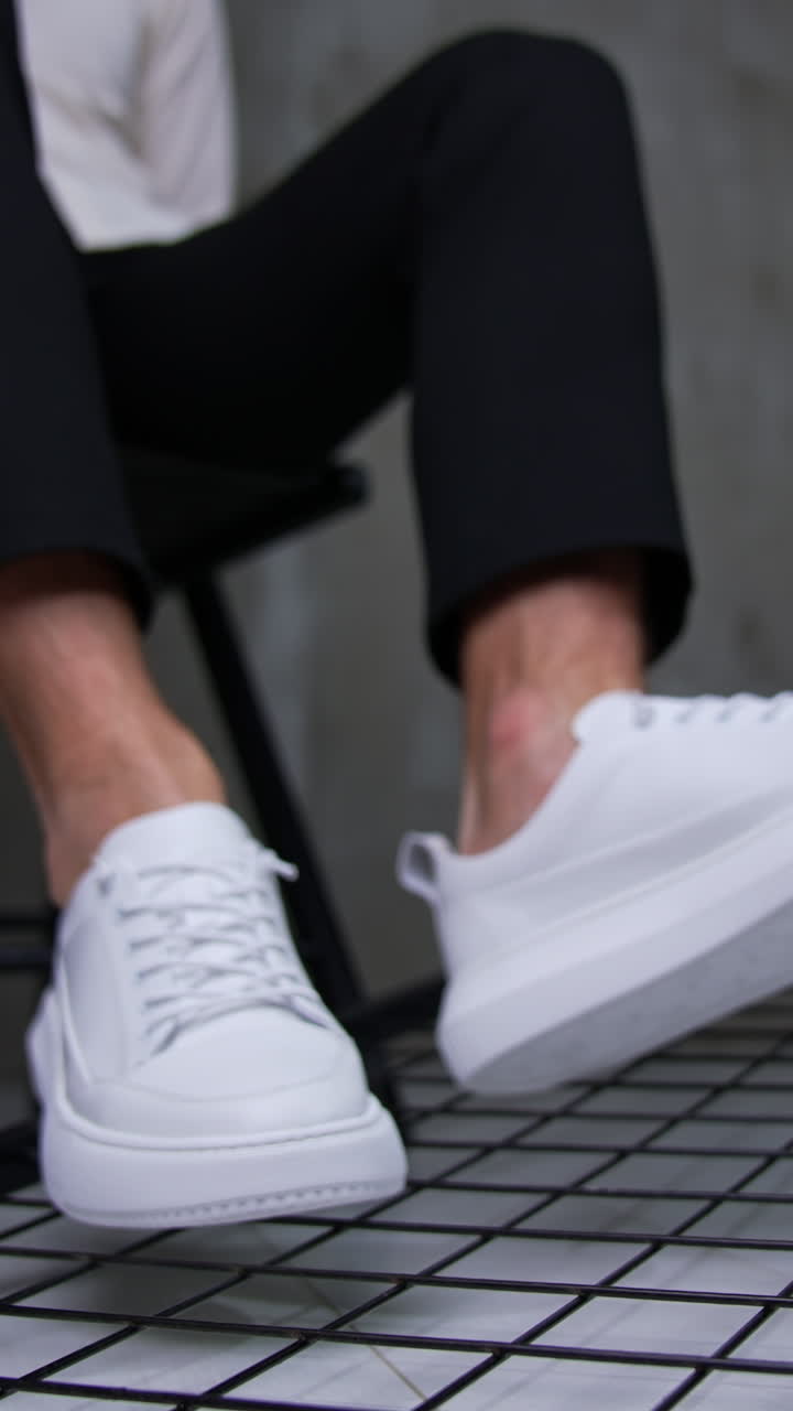 Man Wearing White Sneakers and Black Pants