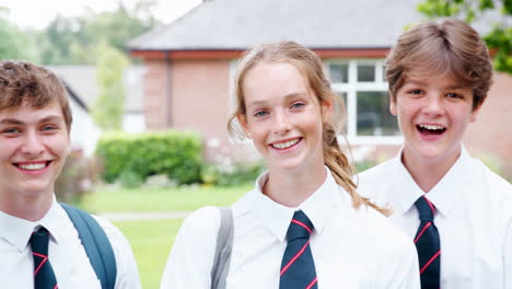 Portrait-Of-Teenage-Students-In-Uniform-Outside-School-Buildings
