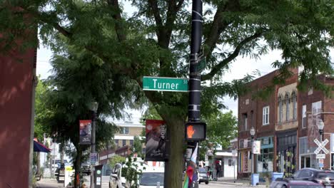 Turner-Street-road-sign-in-Lansing,-Michigan-Old-Town-with-stable-establishing-shot