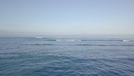 crashing waves on the pacific ocean in waikiki beach honolulu hawaii, aerial dolly