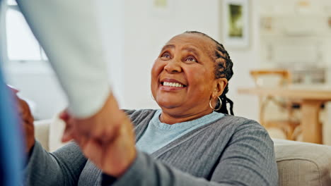 black woman, elderly and holding hands with nurse