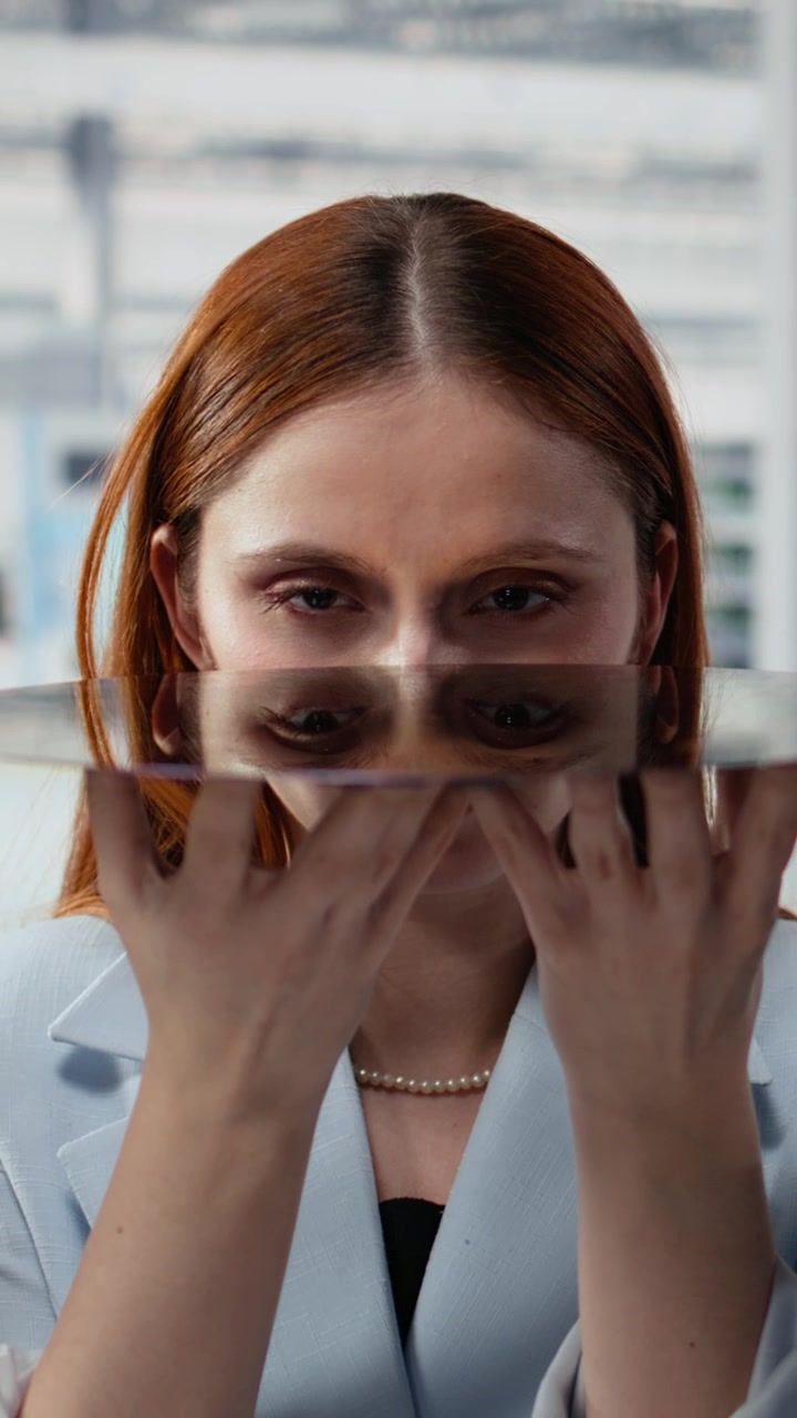 Vertical video Close up of diverse researchers examining silicon wafer in factory office