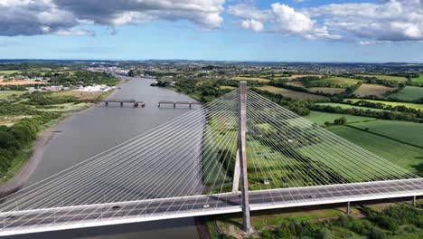 drone flying over the thomas francis meagher suspension bridge with waterford city and wide river suir ireland epic locations gateway to the south east
