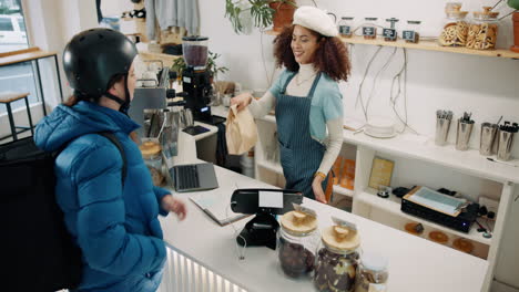 people in a cafe ordering food
