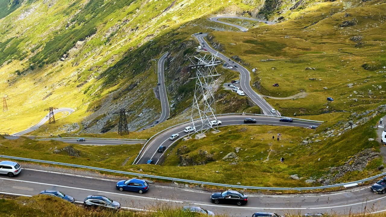 Winding section of Transfagarasan mountain road with cars driving. Winding section of Transfagarasan mountain road with cars driving