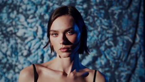 close-up portrait of a woman with short hair and makeup