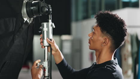 photographer setting up studio lighting