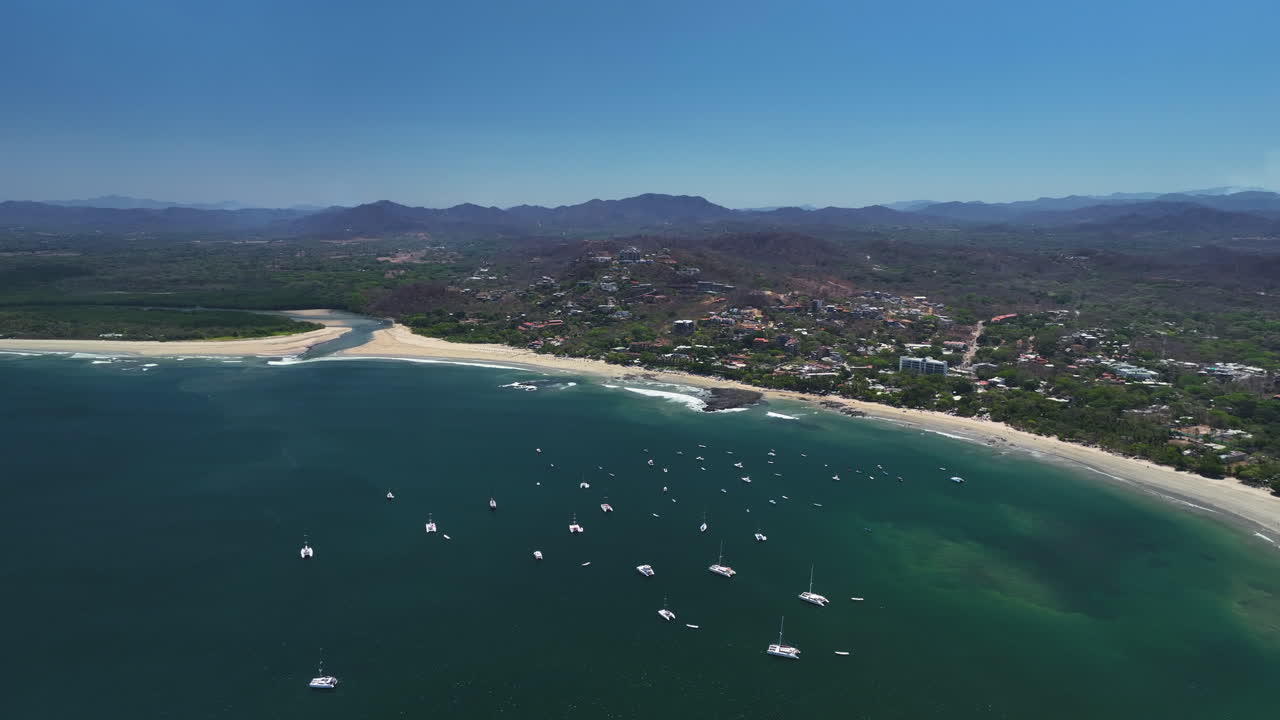 Aerial View of a Tropical Beach with Sailboats