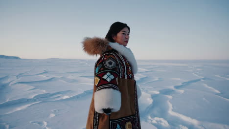 indigenous woman in traditional arctic clothing