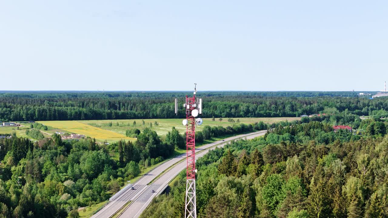 Cell tower and highway road, aerial static view