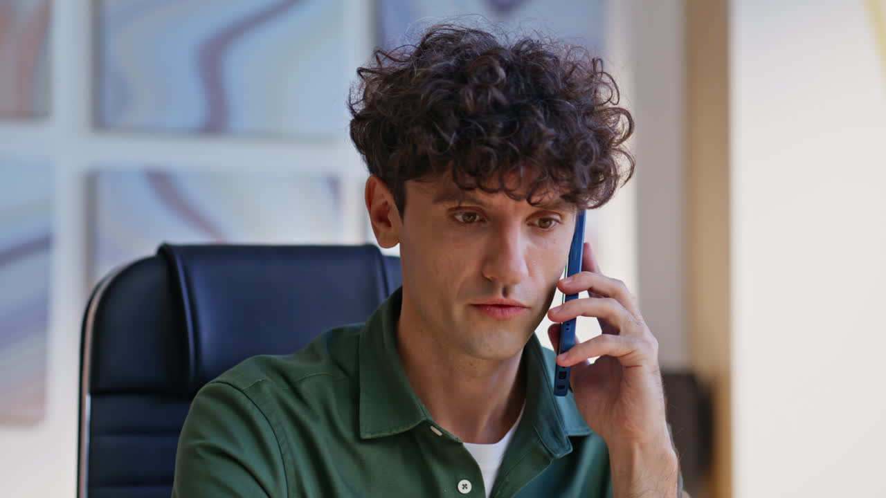 Freelancer discussing work cellphone call at apartment workplace closeup