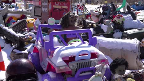 abandoned items like dolls and toys are assembled into art objects in this detroit neighborhood