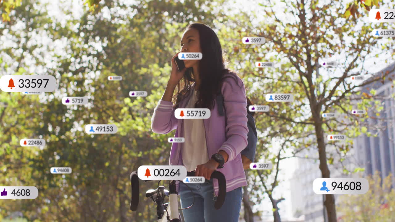 Woman handling bicycle outdoors, talking on smartphone, showing floating media icons for marketing