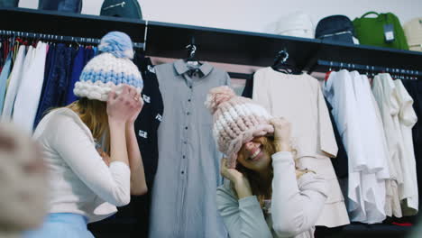 two friends having fun in a clothing store 1