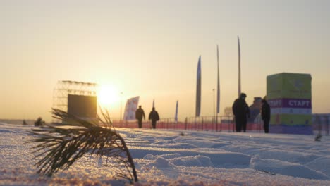 sunset over a snowy sports event