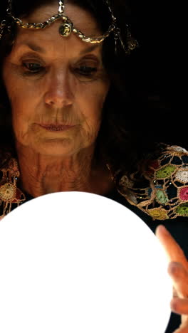 Clairvoyant looking in her crystal ball