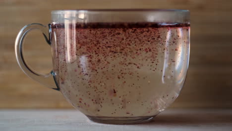 glass cup of pink tea