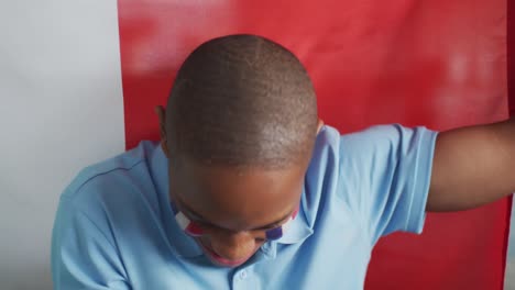 video of happy african american boy with flag of france cheering